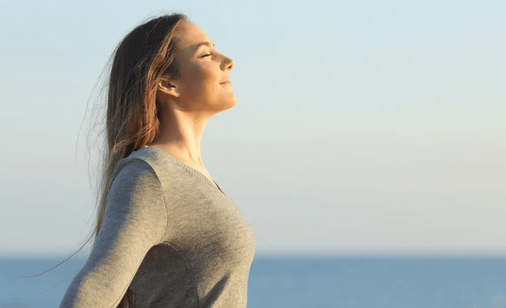 Woman breathing fresh air